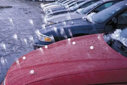 A group of cars parked in a parking lot near Colorado.